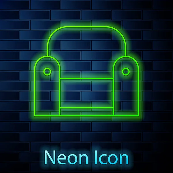 Leuchtende Neon Line Sessel Ikone isoliert auf Backsteinwand Hintergrund. Vektorillustration — Stockvektor