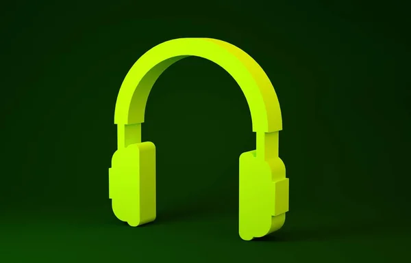 Жовті навушники ізольовані на зеленому фоні. Знак навушників. Концептуальний об'єкт для прослуховування музики, сервісу, зв'язку та оператора. Концепція мінімалізму. 3D ілюстрація 3D рендеринга — стокове фото