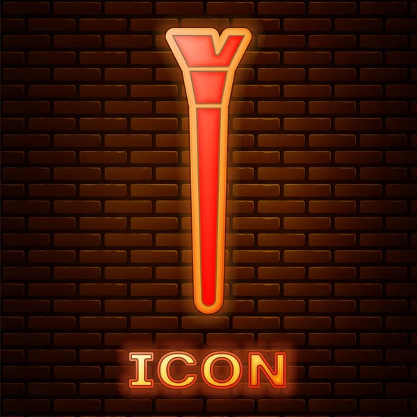 Glowing neon Makeup brush icon isolated on brick wall background.  Vector Illustration