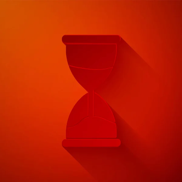 Paper Cut Old Hourglass Flowing Sand Icon Isolated Red Background — Stock vektor