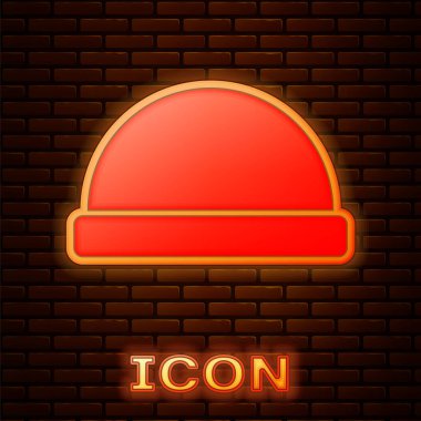 Glowing neon Beanie hat icon isolated on brick wall background.  Vector Illustration