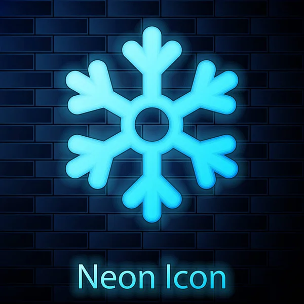 Ícone de floco de neve de néon brilhante isolado no fundo da parede de tijolo. Ilustração vetorial — Vetor de Stock