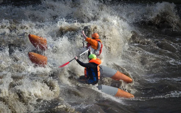 Water sporters in ruw water — Stockfoto