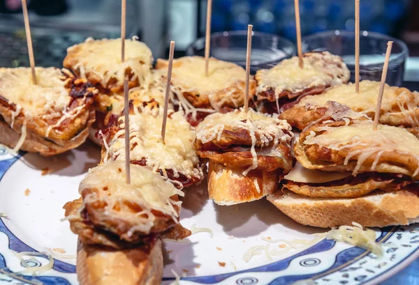 Plate with traditional Spanish snacks called pinchos in San Sebastian city also called Donostia in Gipuzkoa region of Spain