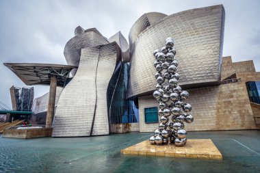Bilbao, Spain - January 27, 2019: Sculpture called Tall Tree and the Eye in front of Guggenheim Museum in Bilbao city in province of Biscay clipart