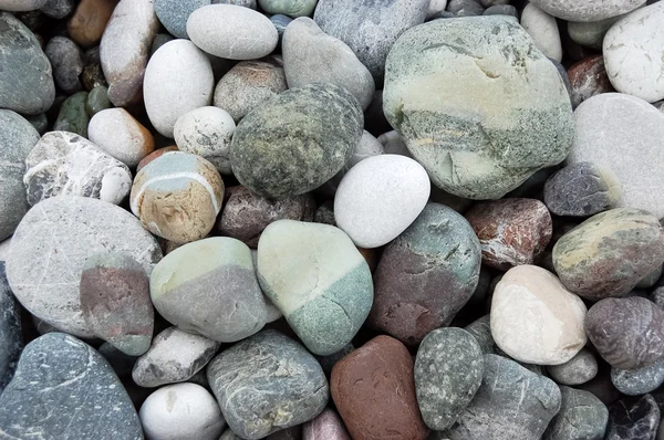 Sahilde deniz çakıl taşları. — Stok fotoğraf