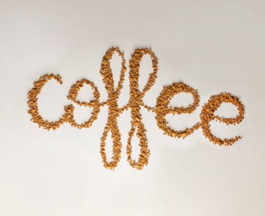 Word kahve bynstant kahve beyaz arka plan üzerinde yazılı. Yazı kavramı