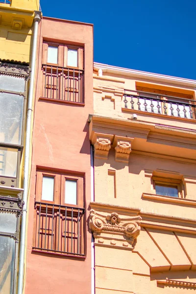 Facade La-Estrecha of houses on the street of the Valencia city, Spain. Houses on the street of the european city.