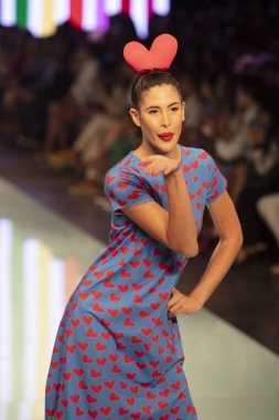 A model walks the runway during the Agatha Ruiz de la Prada Fashion Show Resort 2018 Collection in Miami Fashion Week 2017 at the Ice Palace in Miami on June 4th, 2017 clipart