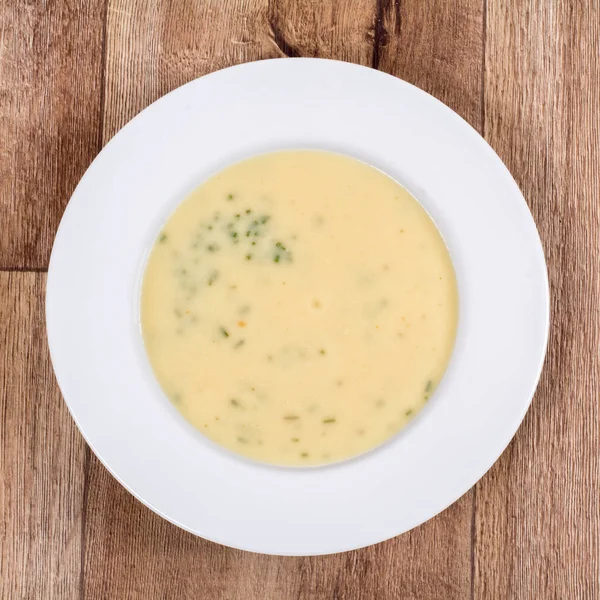 Vegetable soup on a wooden table — Stock Photo, Image