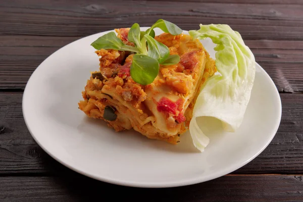 Lasagne with cauliflower on a table — Stock Image Lasagne with cauliflower on a table Royalty Free Stock Images