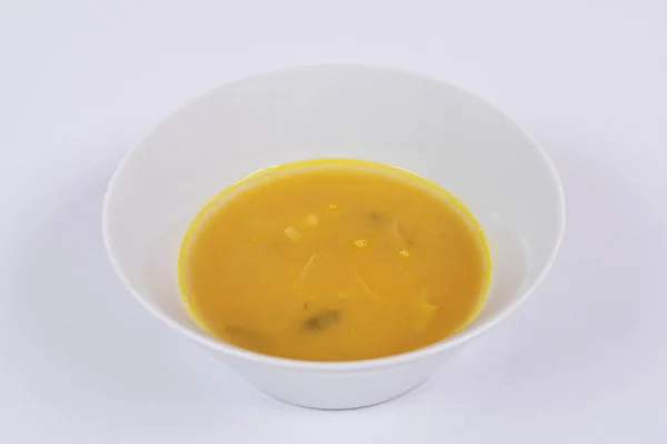 Dýňová polévka s pórkem na bílé — Stock fotografie