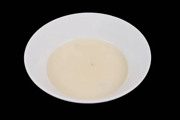 White garlic soup on a black — Stock Photo, Image