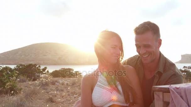 Couple Enjoying Picnic On Cliffs By Sea — Stock Video