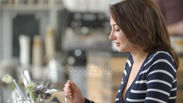 Young woman talking in cafe — Stock Video