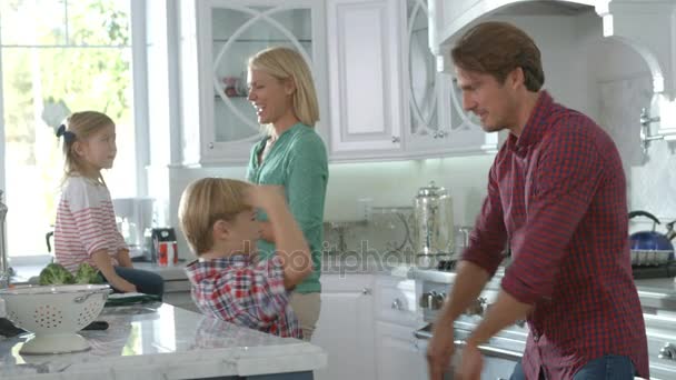 Family Playing Games In Modern Kitchen — Stock Video