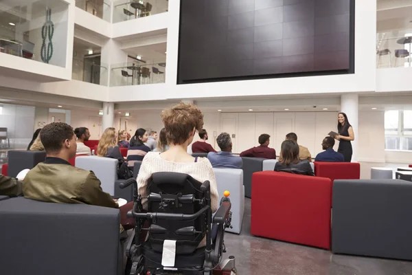 Students at a lecture in a university atrium — Stock Photo, Image