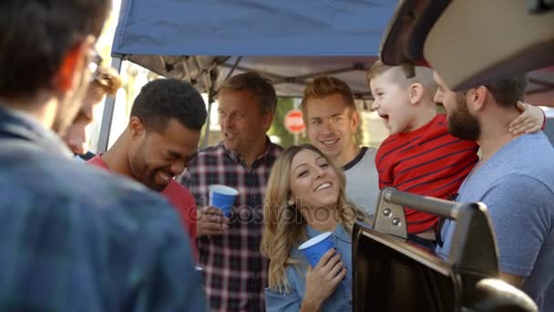 Sports Fans Tailgating In Parking Lot — Stock Video