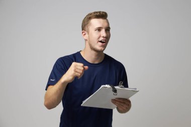 Male Sports Coach With Clipboard clipart