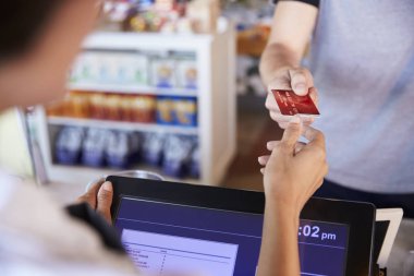 Cashier accepts card payment  clipart