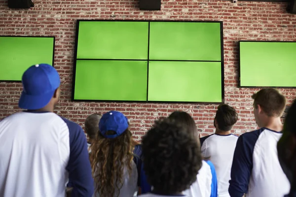 Friends in blue caps Watching Game — Stock Photo, Image