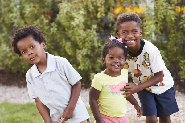 Three african american kids in garden — Stock Photo, Image