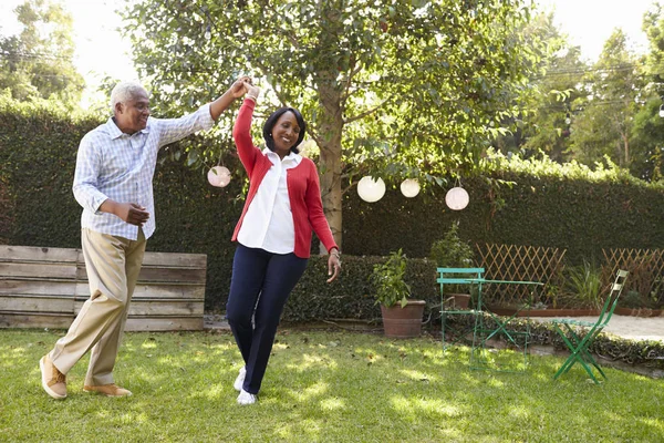 Senior black couple dancing in backyard — Stock Photo, Image