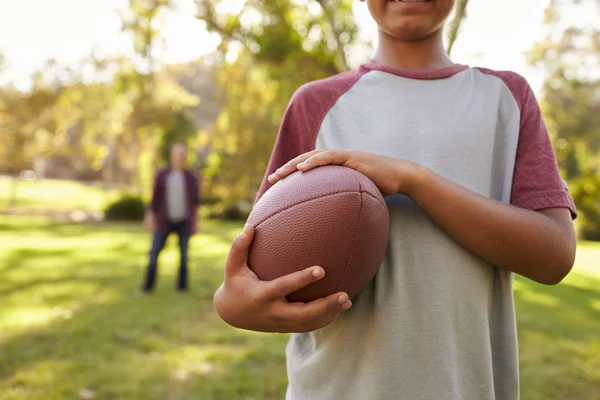 Boy holding football ball — Stock Photo, Image