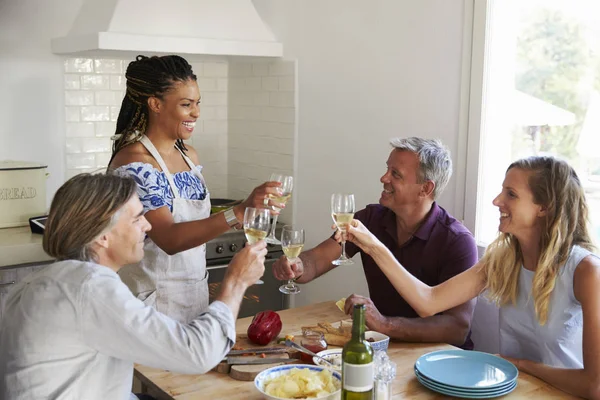 Two couples preparing dinner — Stock Photo, Image
