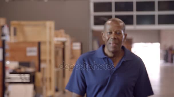 Factory Worker Walks Towards Camera — Stock Video