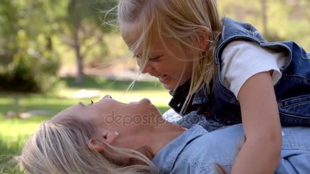 Daughter lying on mother — Stock Video