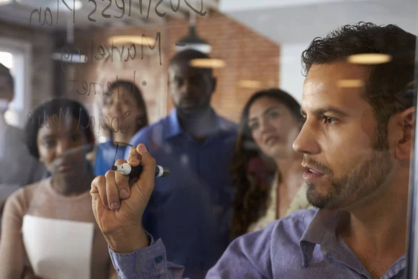 Businessman Writing Ideas On Glass Screen — Stock Photo, Image