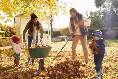 Children Helping Parents Collect Leaves  clipart