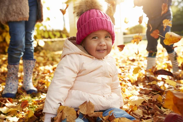 Young Girl Sitting In Leaves — Stock Photo, Image