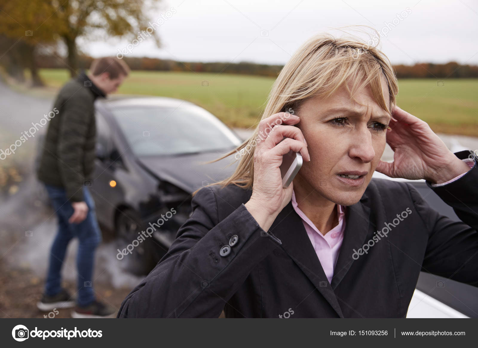 woman-calling-to-report-car-accident-stock-photo-monkeybusiness