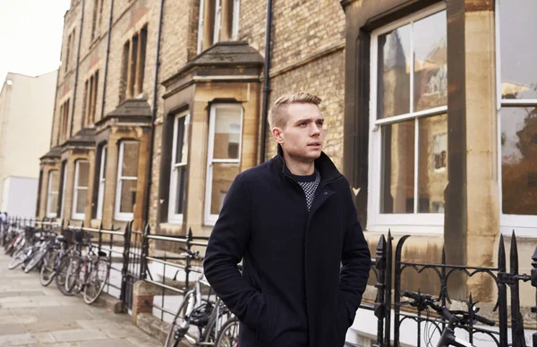 Young Man Walking Along Residential Stree — Stock Photo, Image