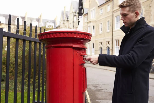 Man Posting Letter In Postbox — Stock Photo, Image