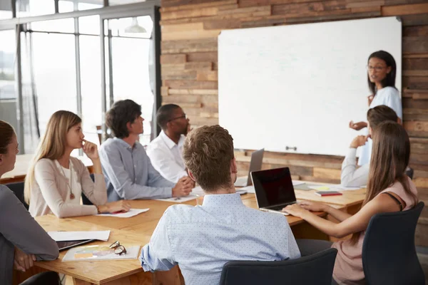 Woman presenting to colleagues — Stock Photo, Image