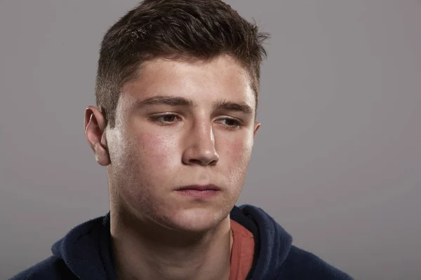 Teenage boy looking down — Stock Photo, Image