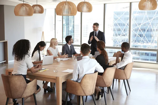 Businessman Stands To Address Meeting — Stock Photo, Image