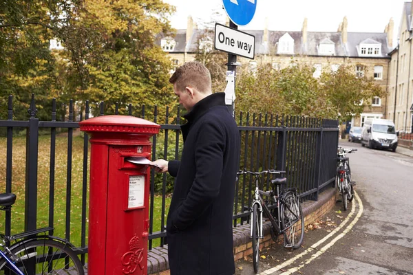 Man Posting Letter In Royal Mail — Stock Photo, Image