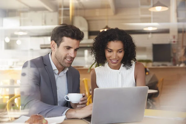 Businesspeople Meet In Coffee Shop