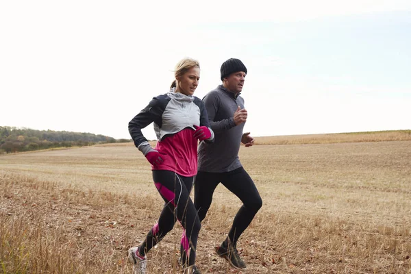 Couple Running Around Autumn Field — Stock Photo, Image