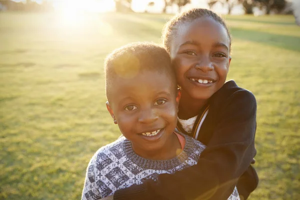 School boy and girl hugging — Stock Photo, Image