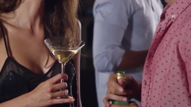Man and woman holding drinks — Stock Video