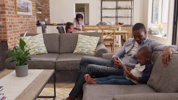 Father And Son Sit On Sofa — Stock Video