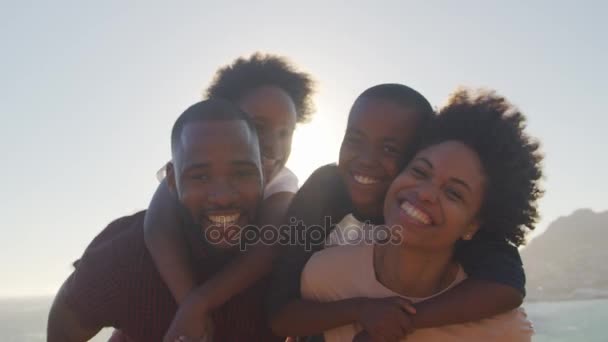 Parents Giving Children Piggybacks — Stock Video