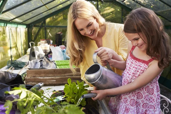 Mother And Daughter Watering Hanging Basket — Stock Photo, Image