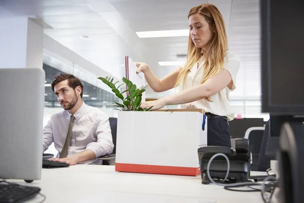 Fired female employee packing box