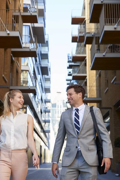 Businessman and businesswoman walking to work — Stock Photo, Image